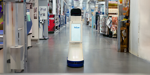 LoweBot in an aisle of a Lowe's Home Improvement store.