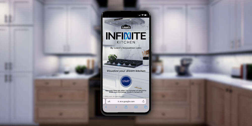 A mobile device with Lowes Innovation Labs Infinite Kitchen AR experience on the screen with kitchen in the background.