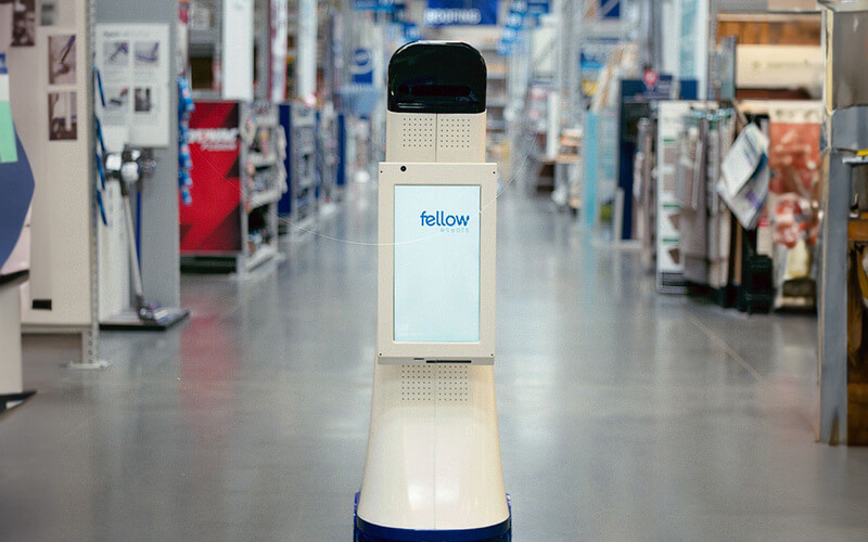 LoweBot in an aisle of a Lowe's Home Improvement store. 